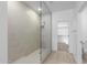 Large bathroom with a walk-in shower and tile flooring at 17975 W Vogel Ave, Goodyear, AZ 85338