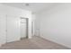 Bedroom with double door closet and access to hallway at 17975 W Vogel Ave, Goodyear, AZ 85338
