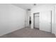 Spacious bedroom with plush carpeting and mirrored closet doors at 17975 W Vogel Ave, Goodyear, AZ 85338