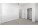 Simple bedroom with neutral carpeting and a large closet at 17975 W Vogel Ave, Goodyear, AZ 85338