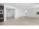 Open concept living area with wood-look floors and a view of the kitchen at 17975 W Vogel Ave, Goodyear, AZ 85338