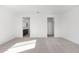 Spacious bedroom with carpet and access to bathroom and closet at 17975 W Vogel Ave, Goodyear, AZ 85338