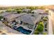 Aerial view of a house with a pool and spa, showcasing the backyard and surrounding area at 26747 N 127Th Dr, Peoria, AZ 85383
