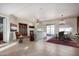 Bright and spacious living room with tile floors and fireplace at 26747 N 127Th Dr, Peoria, AZ 85383