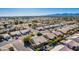 Aerial view showing houses, a pool, and a playground in the distance at 14428 W Carlin Dr, Surprise, AZ 85374