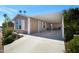 Mobile home with carport and landscaping at 201 S Greenfield Rd # 11, Mesa, AZ 85206