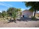 Backyard with gravel, trees, and AC unit at 201 S Greenfield Rd # 11, Mesa, AZ 85206