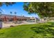 Community pool with lounge chairs and tables at 201 S Greenfield Rd # 11, Mesa, AZ 85206