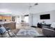 Spacious living room with leather sofas and a ceiling fan at 201 S Greenfield Rd # 11, Mesa, AZ 85206