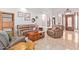 Living room with leather sofas, a coffee table, and wood shelving at 6918 E Granada St, Mesa, AZ 85207