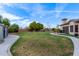 Expansive backyard with a large lawn and shed at 6918 E Granada St, Mesa, AZ 85207