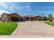 Two-story home exterior with a large yard and driveway at 6918 E Granada St, Mesa, AZ 85207