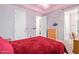 Bedroom with red bedding and en-suite bathroom access at 6918 E Granada St, Mesa, AZ 85207