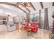 Bright living room with high ceilings, exposed beams, and a cozy seating area at 6918 E Granada St, Mesa, AZ 85207