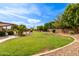 Landscaped backyard featuring a large grassy area at 6918 E Granada St, Mesa, AZ 85207