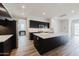 Contemporary kitchen with dark cabinetry and large kitchen island at 10037 E Toledo Ave, Mesa, AZ 85212