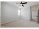 Bright bedroom with ceiling fan and carpet flooring at 10037 E Toledo Ave, Mesa, AZ 85212