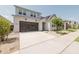 Modern two-story house with driveway and front yard at 10037 E Toledo Ave, Mesa, AZ 85212