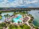 Aerial view of community pool and lake at 42818 W Morning Dove Ln, Maricopa, AZ 85138