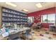 Community art studio with tables and shelves for supplies at 42818 W Morning Dove Ln, Maricopa, AZ 85138