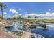 Serene community water feature with cascading waterfalls at 42818 W Morning Dove Ln, Maricopa, AZ 85138