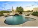 Stunning pool with waterfall feature and desert landscape at 31818 N 68Th St, Cave Creek, AZ 85331