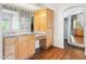 Primary bathroom with double vanity, large mirror, and wood cabinets at 31818 N 68Th St, Cave Creek, AZ 85331