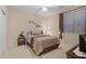 Bedroom with a double bed, nightstand, and window blinds at 42818 W Morning Dove Ln, Maricopa, AZ 85138