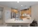 L-shaped kitchen with stainless steel appliances and an island at 42818 W Morning Dove Ln, Maricopa, AZ 85138
