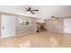 Bright living room with tile floors, fireplace, and ceiling fans at 1712 S Hardy Dr, Tempe, AZ 85281