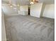 Spacious loft area with high ceilings and neutral carpeting at 12059 W Carlota Ln, Sun City, AZ 85373