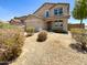 Two-story house with attached garage and desert landscaping at 12059 W Carlota Ln, Sun City, AZ 85373