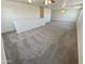 Bright and airy loft area with ceiling fan and carpeted floor at 12059 W Carlota Ln, Sun City, AZ 85373