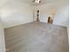 Spacious main bedroom with carpeted floor and access to bathroom at 12059 W Carlota Ln, Sun City, AZ 85373
