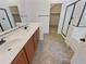 Main bathroom with double vanity and walk-in shower at 12059 W Carlota Ln, Sun City, AZ 85373