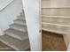 Spacious pantry and carpeted staircase at 12059 W Carlota Ln, Sun City, AZ 85373