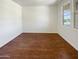 Bright home office with wood flooring and large window at 12059 W Carlota Ln, Sun City, AZ 85373