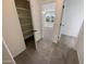 Upstairs hallway with access to bedrooms and closet at 12059 W Carlota Ln, Sun City, AZ 85373