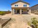 Two-story house with covered patio and spacious backyard at 12059 W Carlota Ln, Sun City, AZ 85373