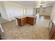 Kitchen island with granite countertop and wooden cabinets at 12059 W Carlota Ln, Sun City, AZ 85373