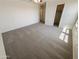 Spacious bedroom with carpeted flooring and large closet at 12059 W Carlota Ln, Sun City, AZ 85373