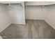Spacious walk-in closet with double hanging rods and neutral carpeting at 12059 W Carlota Ln, Sun City, AZ 85373