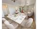 Bright dining room with hardwood floors and seating for six at 12059 W Carlota Ln, Sun City, AZ 85373