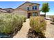 Two-story home with front yard landscaping and attached garage at 12059 W Carlota Ln, Sun City, AZ 85373