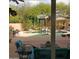 Relaxing backyard with a sparkling pool, spa, and patio furniture at 12459 N 116Th St, Scottsdale, AZ 85259