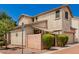 Tan two-story house with a landscaped yard and driveway at 4360 E Carla Vista Dr, Gilbert, AZ 85295