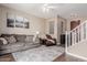 Bright living room with hardwood floors and an open staircase at 4360 E Carla Vista Dr, Gilbert, AZ 85295