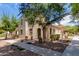 Two-story home with arched entryway and mature trees at 4360 E Carla Vista Dr, Gilbert, AZ 85295