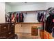 Large walk-in closet with ample shelving and hanging space at 16806 W Halifax St, Surprise, AZ 85374