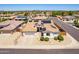 Single-story house with solar panels and neighborhood view at 16806 W Halifax St, Surprise, AZ 85374